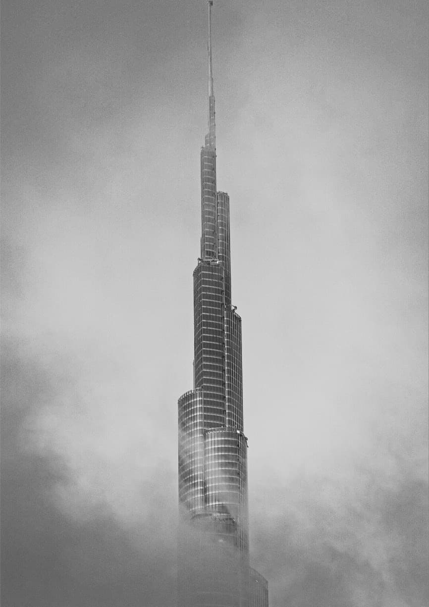 Burj Khalifa rising through fog, black and white