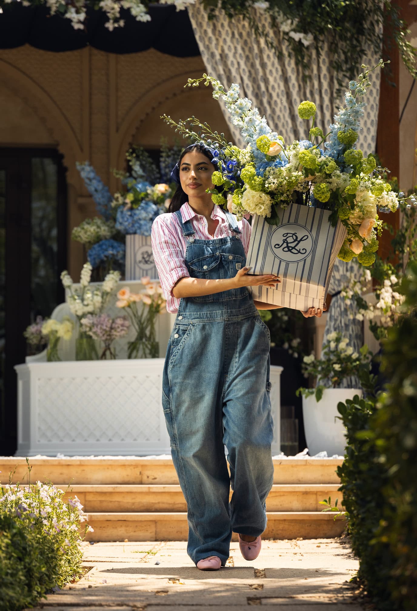 Ralph Lauren campaign — woman carrying a monogrammed box of flowers